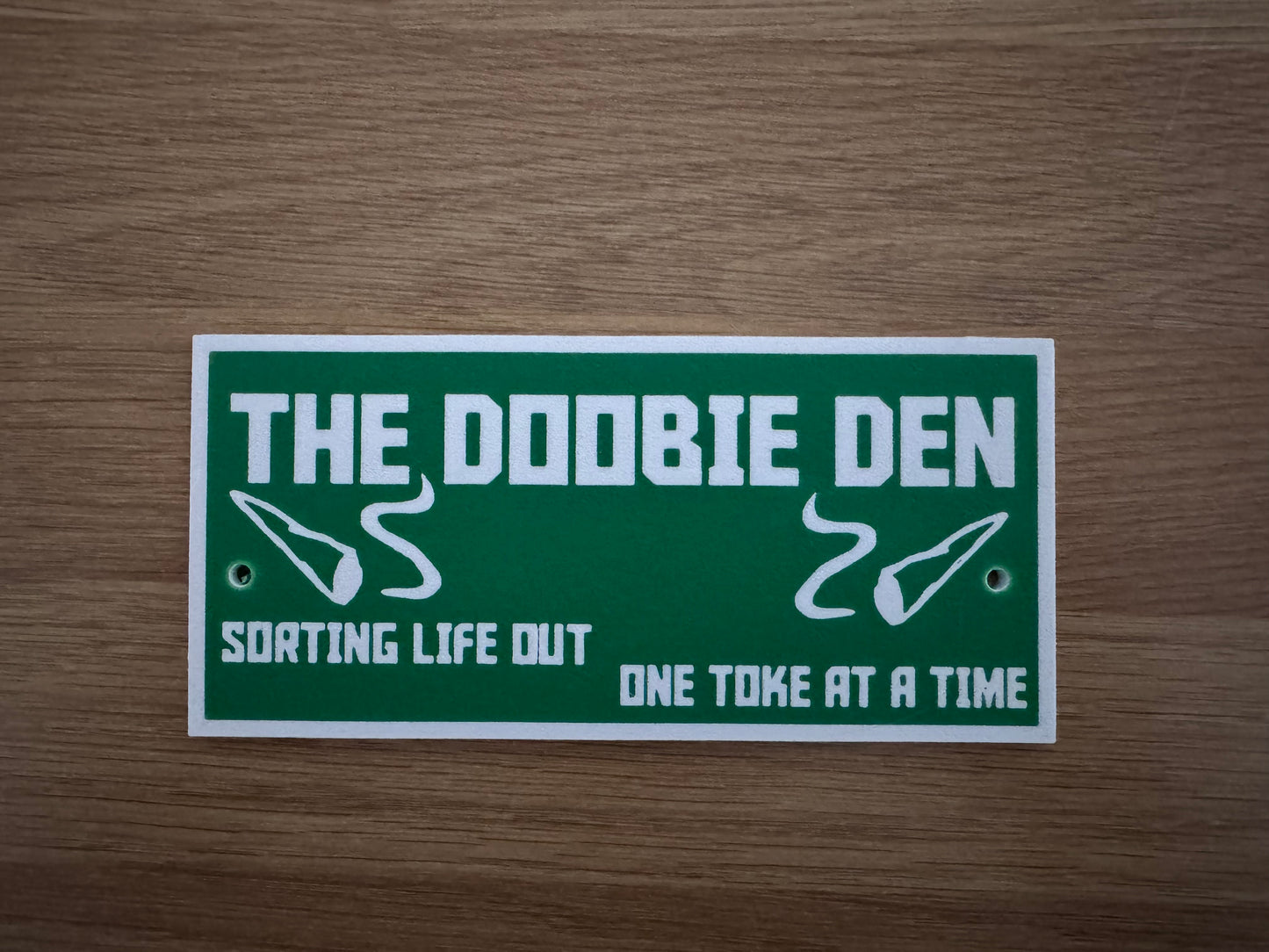 The Doobie Den plaque