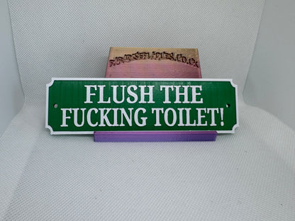 Flush the fucking toilet plaque