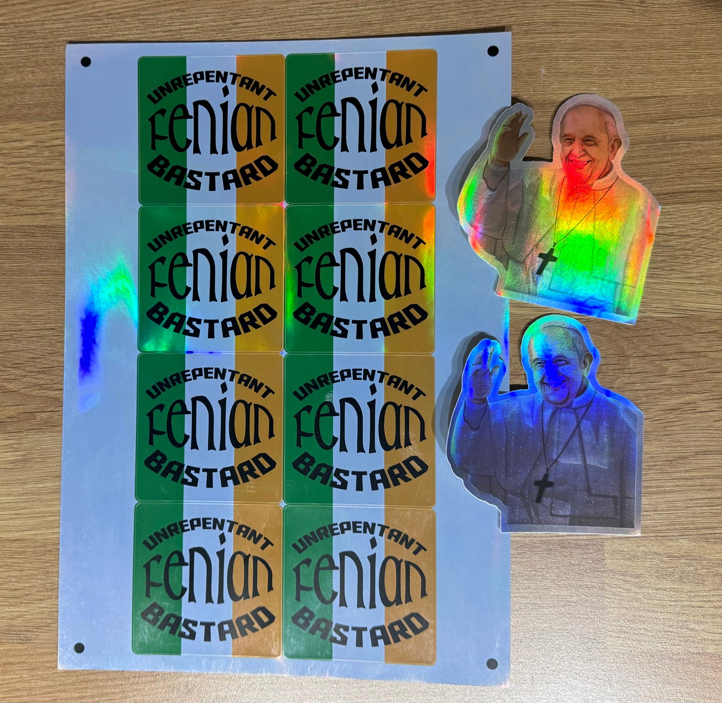 Holographic unrepentant fenian and Pope stickers.